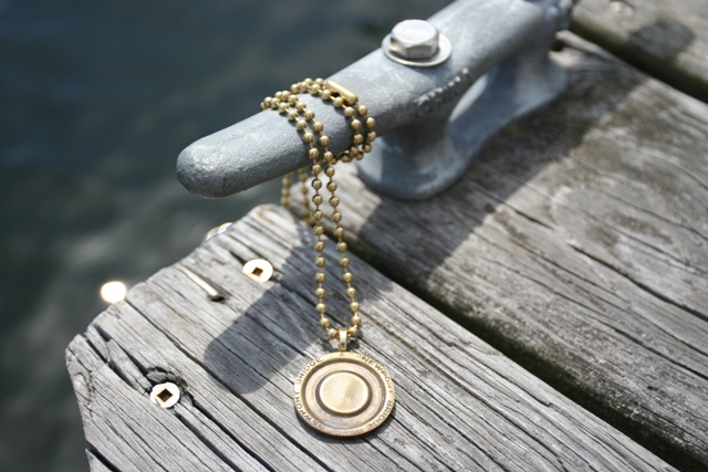 Now you can wear a piece of Newport, Rhode Island\'s history. A genuine Newport (aka Claiborn Pell) Bridge token is the centerpiece of this necklace.